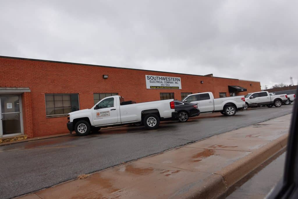 A commercial office building in Wichita, KS, with a professionally painted brick exterior. The refreshed façade improves curb appeal and maintains a professional business presence.
